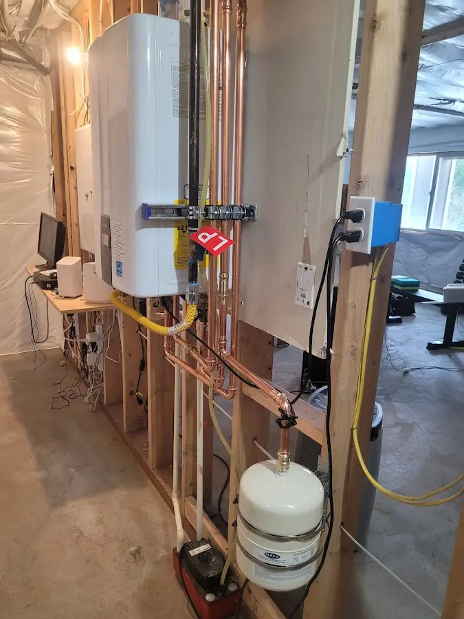 Licensed plumber repairing a kitchen sink in Benson